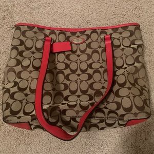 Coach purse - orange/coral in color